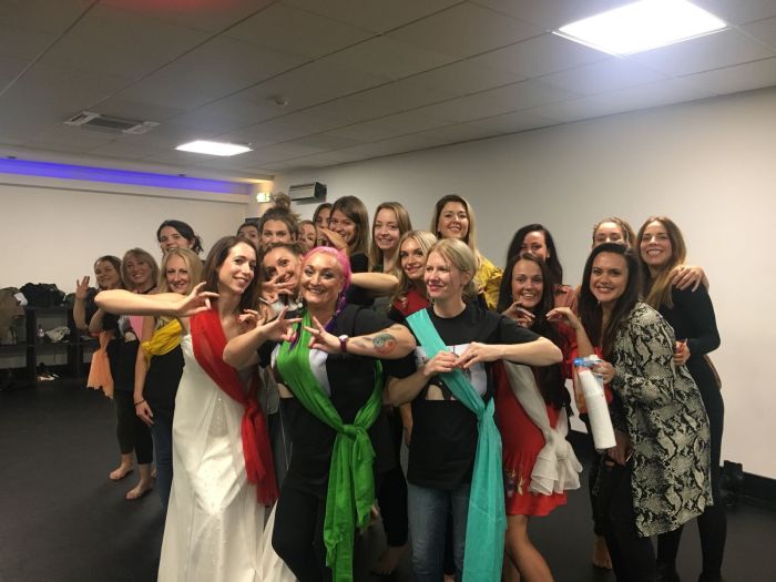 Colorful Bollywood hen party group dancing in York